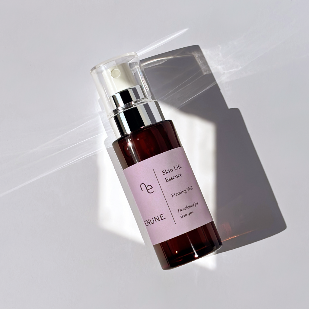 ENUNE Skin Lift Essence firming veil serum bottle with silver pump on white background