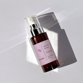 ENUNE Skin Lift Essence firming veil serum bottle with silver pump on white background